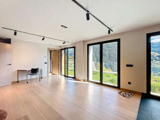 Experience luxury living in this stunning property, featuring expansive windows that frame breathtaking mountain views.