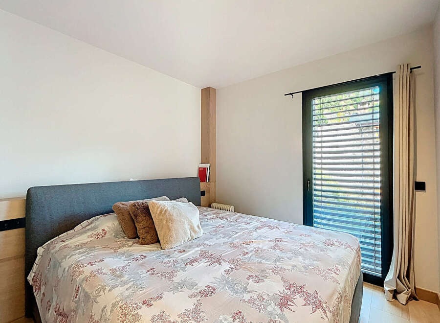 This bedroom offers a serene retreat with its comfortable bed and inviting ambiance.