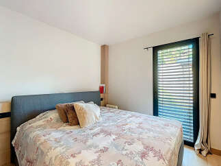 This bedroom offers a serene retreat with its comfortable bed and inviting ambiance.