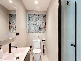 Step into a modern oasis with this stylish bathroom design.