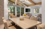 Experience luxury living in this stunning property, featuring a spacious dining area with a modern design.