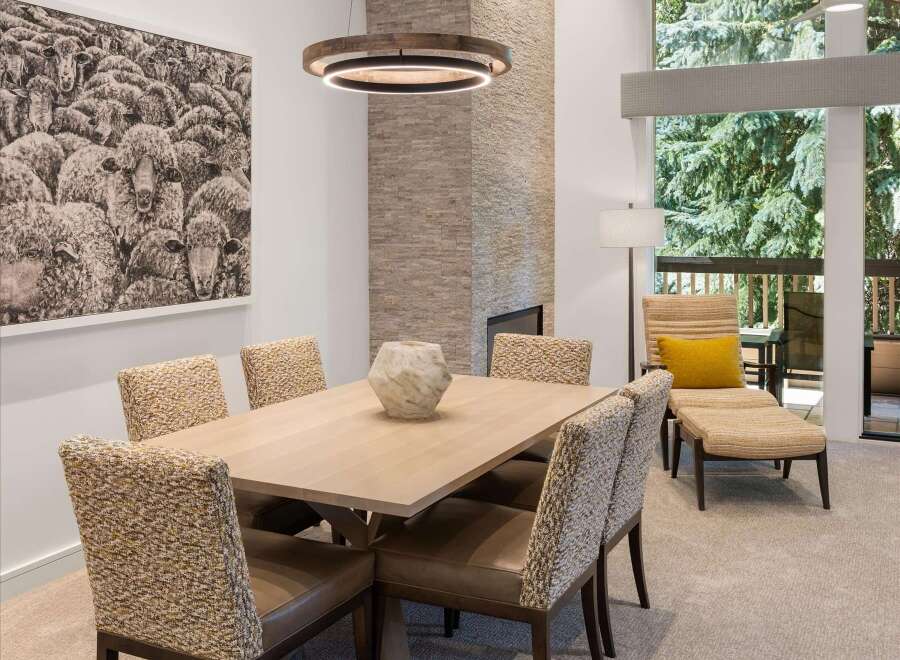 This stunning dining room showcases a modern design with a touch of rustic charm.