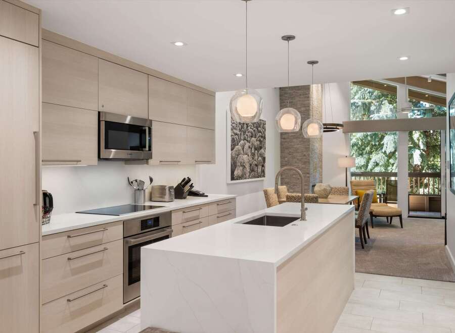 This stunning kitchen boasts modern design with sleek cabinetry and a spacious island, perfect for culinary enthusiasts.