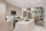 This stunning kitchen boasts modern design with sleek cabinetry and a spacious island, perfect for culinary enthusiasts.