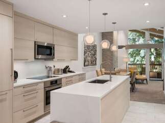 This stunning kitchen boasts modern design with sleek cabinetry and a spacious island, perfect for culinary enthusiasts.