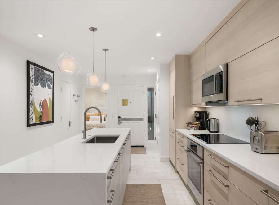 Experience modern luxury in this stunning kitchen! Featuring sleek cabinetry, a spacious island, and high-end appliances, this space is perfect for both cooking and entertaining.