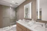 Step into luxury with this stunning bathroom featuring a modern design and high-end finishes.