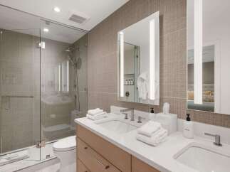 Step into luxury with this stunning bathroom featuring a modern design and high-end finishes.
