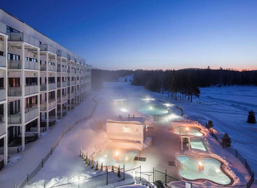 Experience the ultimate winter getaway at this stunning property! Featuring multiple outdoor hot tubs and a modern building, this location offers a unique blend of relaxation and luxury.