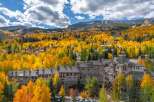 Experience the beauty of mountain living in this stunning property, surrounded by vibrant fall foliage.