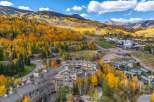 Discover luxury living in this stunning mountain retreat, nestled amidst the vibrant fall foliage.