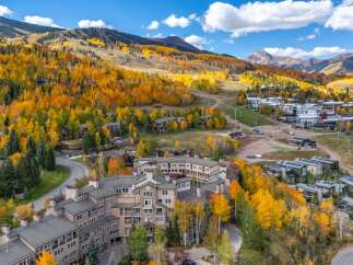 Discover luxury living in this stunning mountain retreat, nestled amidst the vibrant fall foliage.