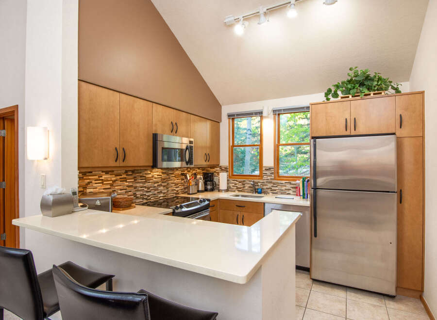 This stunning kitchen boasts modern appliances and ample counter space, perfect for culinary enthusiasts.