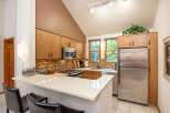 This stunning kitchen boasts modern appliances and ample counter space, perfect for culinary enthusiasts.