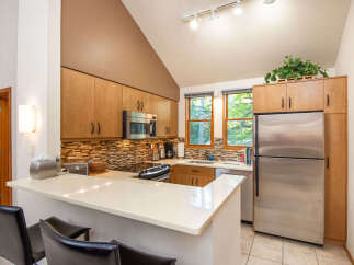This stunning kitchen boasts modern appliances and ample counter space, perfect for culinary enthusiasts.