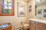 This inviting bathroom features a serene ambiance with its neutral color palette and natural light.