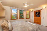 This inviting bedroom showcases a cozy atmosphere with its comfortable bed and scenic views.