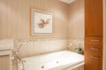 This luxurious bathroom features a modern soaking tub, perfect for relaxation.