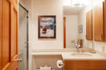 This bathroom features a stylish design with a modern vanity and a sleek sink.