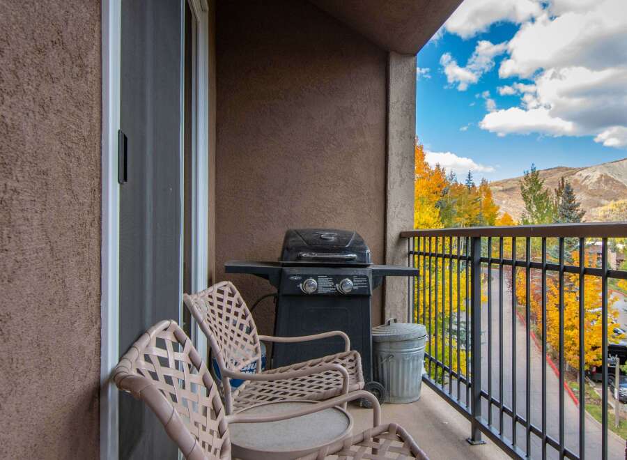 Enjoy the stunning mountain views from this charming balcony.