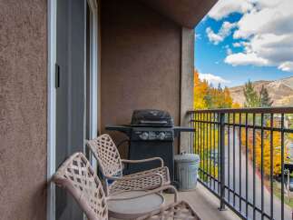 Enjoy the stunning mountain views from this charming balcony.