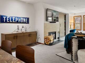 Experience luxury living in this stunning property featuring a cozy fireplace, perfect for chilly evenings.