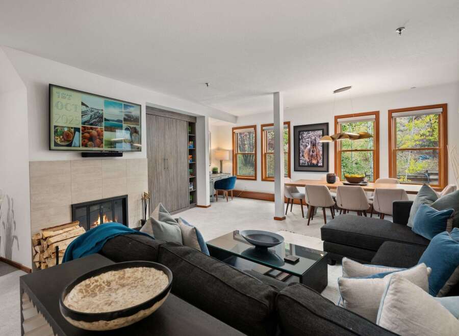Experience luxury living in this stunning property, featuring a cozy fireplace and a modern, open-concept design.