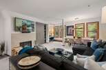 Experience luxury living in this stunning property, featuring a cozy fireplace and a modern, open-concept design.