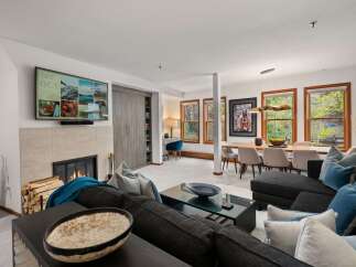 Experience luxury living in this stunning property, featuring a cozy fireplace and a modern, open-concept design.