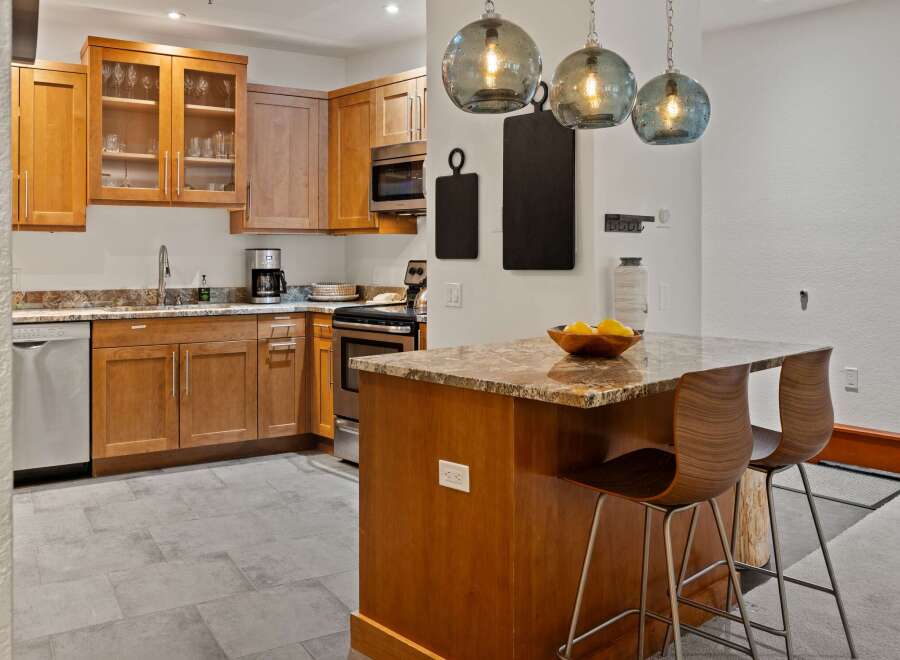 This stunning kitchen boasts beautiful wooden cabinetry, offering ample storage and a warm, inviting atmosphere.