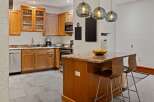 This stunning kitchen boasts beautiful wooden cabinetry, offering ample storage and a warm, inviting atmosphere.
