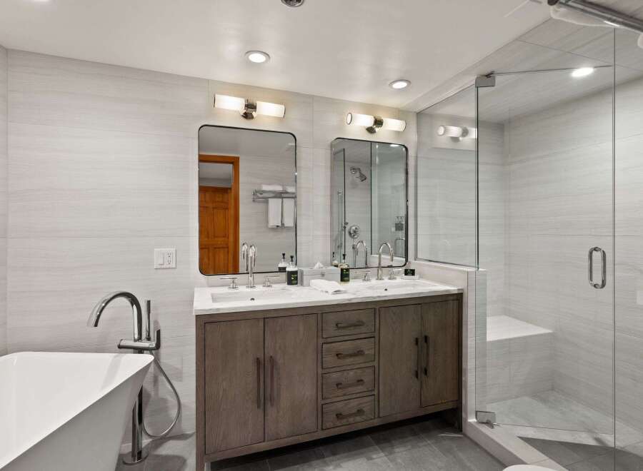 Step into luxury with this stunning bathroom featuring a sleek, modern design.