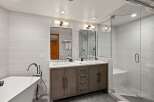 Step into luxury with this stunning bathroom featuring a sleek, modern design.