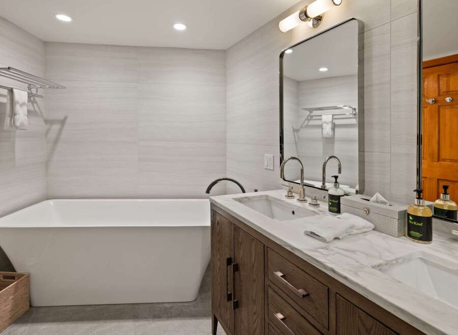 Step into luxury with this stunning bathroom featuring a modern design and high-end finishes.