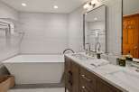 Step into luxury with this stunning bathroom featuring a modern design and high-end finishes.