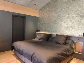 Discover the epitome of modern comfort in this stylish bedroom.