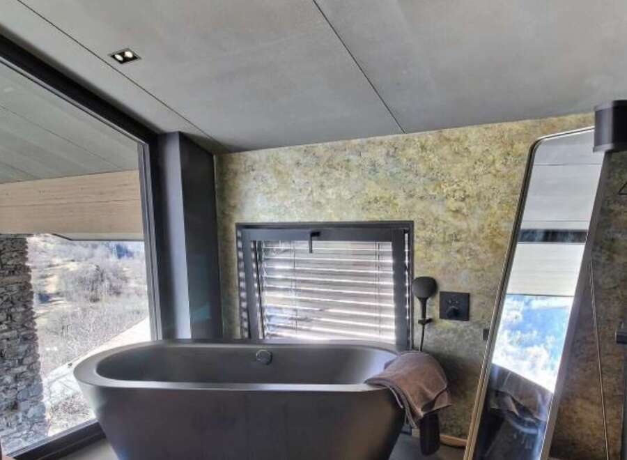 Indulge in luxury with this stunning bathroom featuring a sleek, modern design.