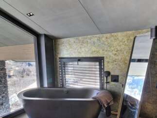 Indulge in luxury with this stunning bathroom featuring a sleek, modern design.