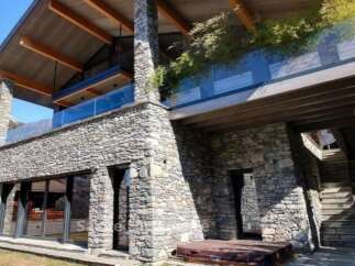 Discover luxury living in this stunning stone-clad property.