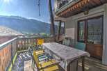 Enjoy breathtaking mountain views from this charming balcony.