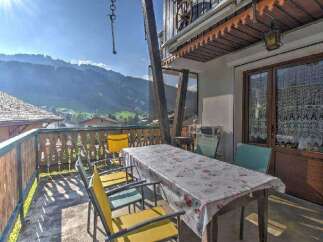Enjoy breathtaking mountain views from this charming balcony.