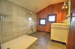 Step into this stunning bathroom featuring a modern walk-in shower with glass enclosure.