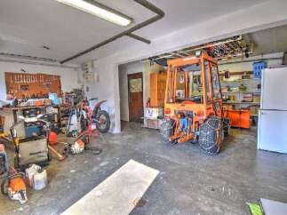 This spacious garage offers ample storage and workspace for various projects.