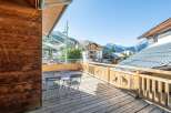 Enjoy breathtaking mountain views from this charming balcony.