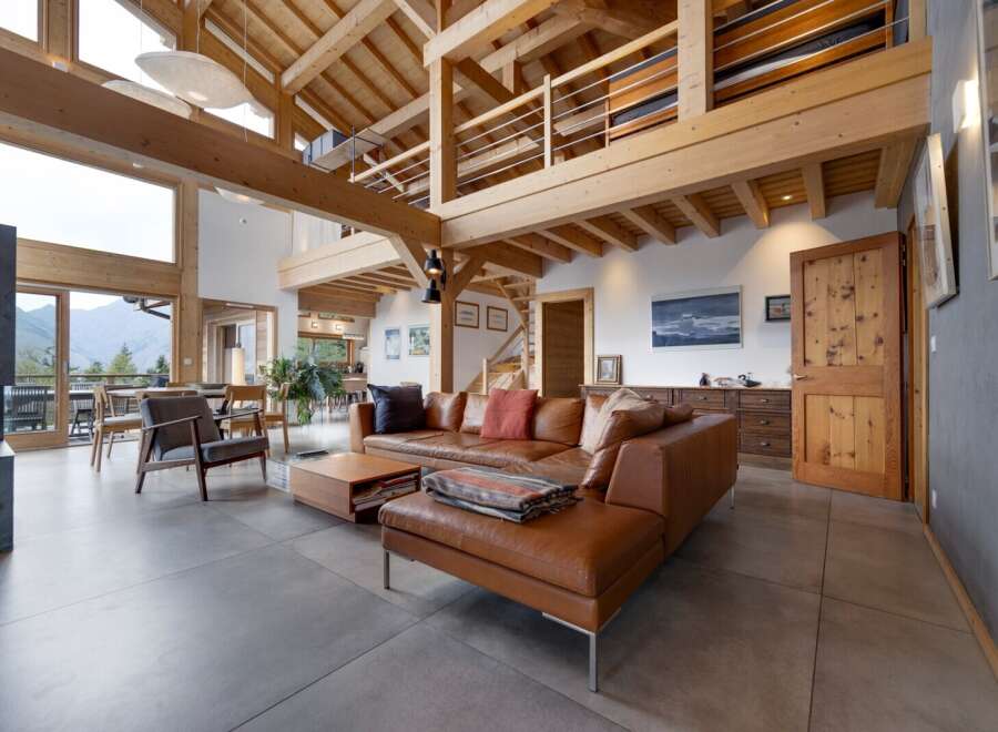 Experience luxury living in this stunning property featuring a spacious living area with a cozy fireplace.