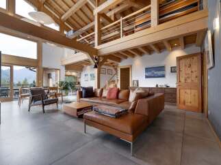 Experience luxury living in this stunning property featuring a spacious living area with a cozy fireplace.