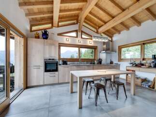 Experience the epitome of modern living in this stunning kitchen, featuring a seamless blend of natural wood elements and contemporary design.