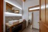 This stunning bathroom features a modern design with a touch of rustic charm.