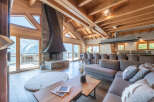Experience luxury living in this stunning chalet, boasting breathtaking mountain views and a cozy fireplace.
