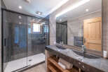 Step into luxury with this stunning bathroom featuring a sleek, modern design.